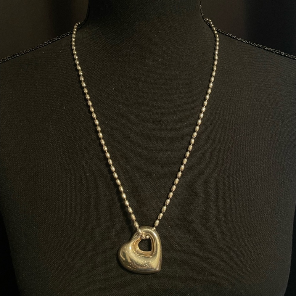 silver chain and heart necklace